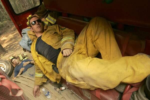 News/--After nearly seven days on the Orr fire line, Nathaniel O'Neill, right and Ken Azevedo of Mendocino County Cal Fire get some much needed rest near the Running Springs Ranch, Friday June 27, 2008. (Kent Porter / The Press Democrat) 2008