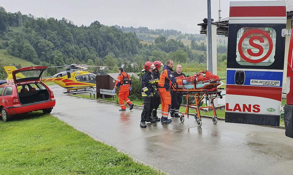 Rescue helicopter and ambulance have brought to hospital the first people injured by a lighting strike that struck in Poland's southern Tatra Mountains during a sudden thunderstorm, in Zakopane, Poland, on Thursday, Aug. 22, 2019.(AP Photo/Bartlomiej Jurecki)