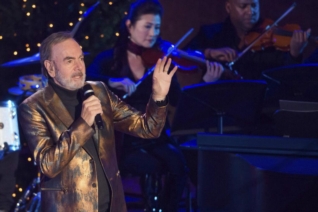 Neil Diamond performs at the 84th Annual Rockefeller Center Christmas Tree lighting ceremony on Wednesday, Nov. 30, 2016, in New York. (Photo by Charles Sykes/Invision/AP)