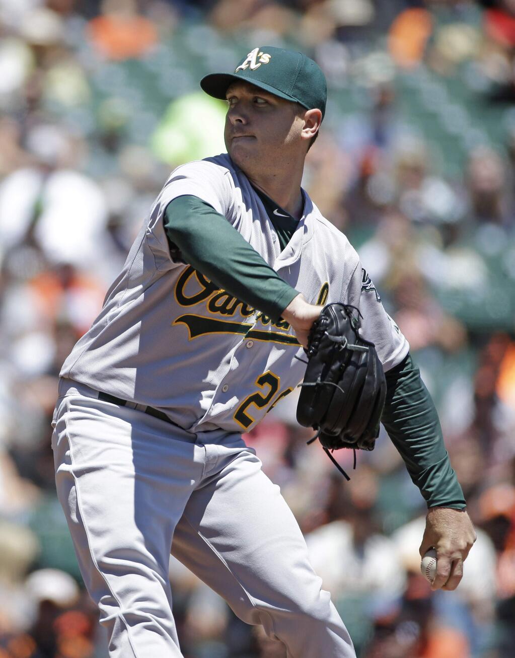 Oakland Athletics starting pitcher Scott Kazmir throws against the San Francisco Giants in the first inning of their interleague baseball game Thursday, July 10, 2014, in San Francisco. (AP Photo/Eric Risberg)