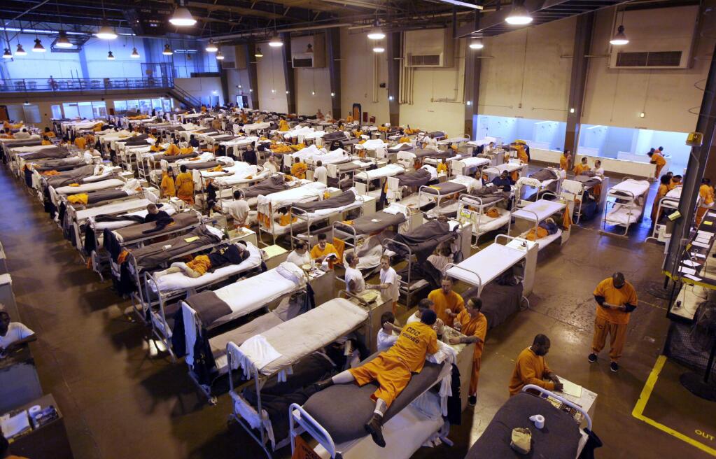 Several hundred inmates crowd the gymnasium at San Quentin prison in 2009. Proposition 47, a ballot measure passed in 2014, has helped reduce prison crowding in California. (ERIC RISBERG / Associated Press)