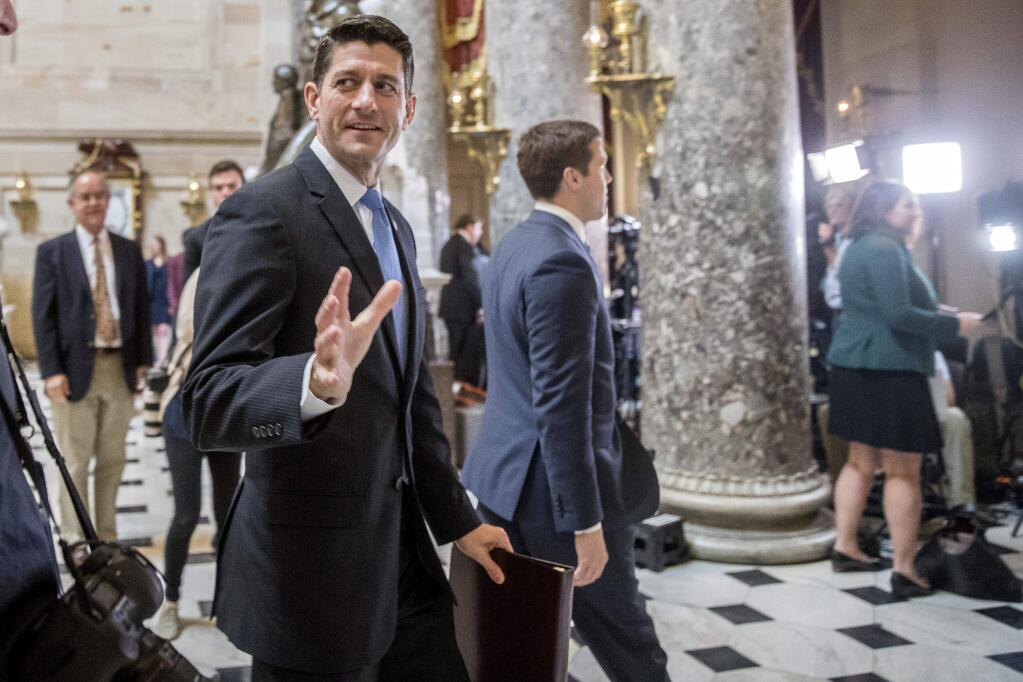 House Speaker Paul Ryan of Wis. greets guests as he walks to the House Chamber on Capitol Hill in Washington, Thursday, May 4, 2017. (AP Photo/Andrew Harnik)