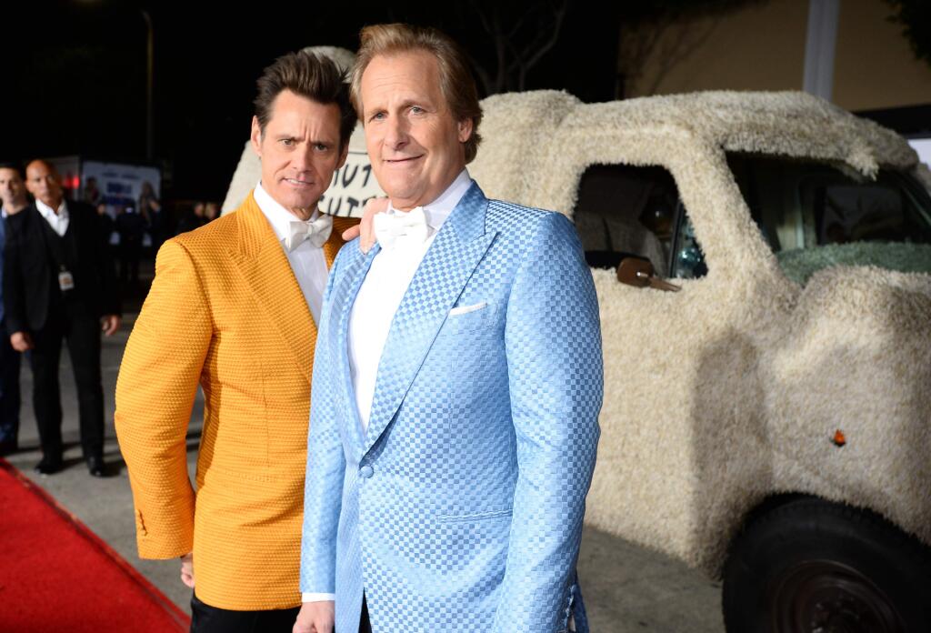 Jim Carrey, left, and Jeff Daniels arrive at the premiere of 'Dumb and Dumber To' at the Regency Village Theatre on Monday, Nov. 3, 2014, in Los Angeles. (Photo by Jordan Strauss/Invision/AP)