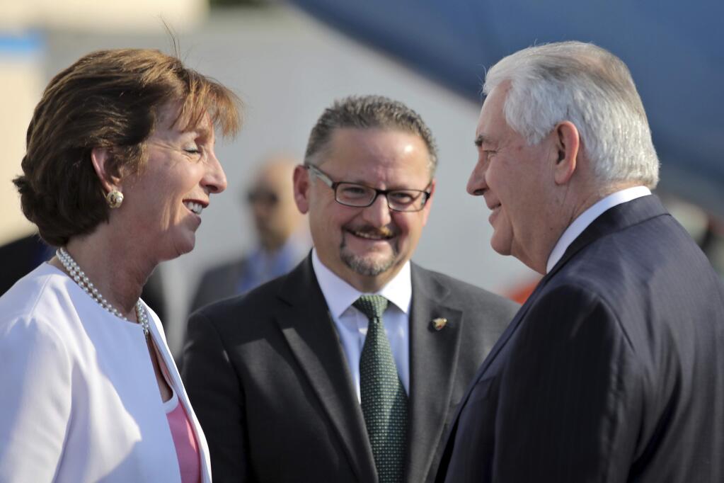 U.S. Secretary of State Rex Tillerson is welcome by U.S. ambassador Roberta Jacobson, left, and Mauricio Ibarra, center, director of North American affairs at the Mexican foreign affairs ministry as he arrives at Benito Juarez international Airport in Mexico City, Wednesday, Feb. 22, 2017. (Carlos Barria/Pool photo via AP)