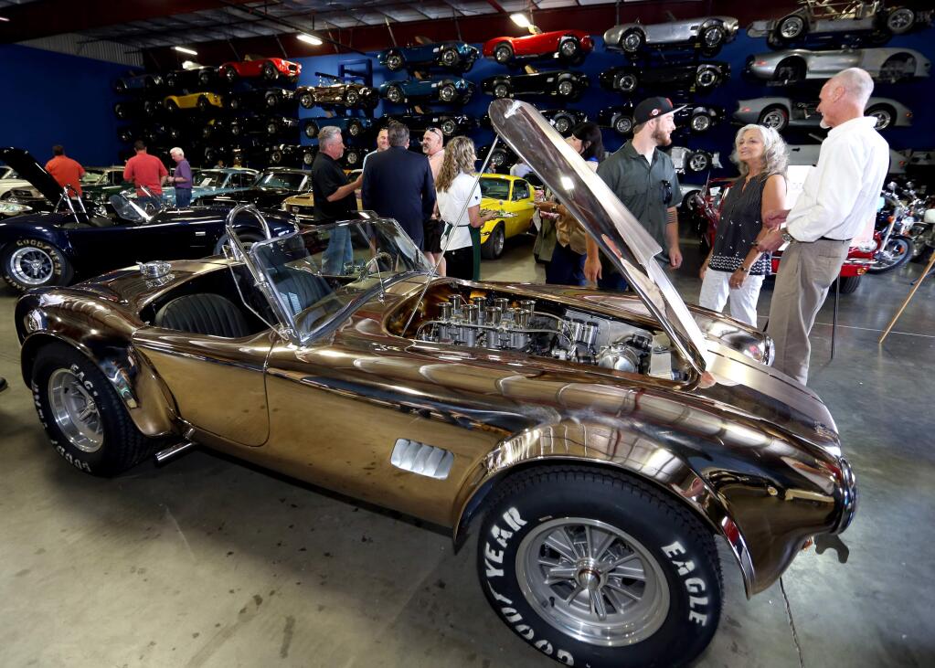 'Supercharged,' fundraiser to raises money for a new Saralee and Richard Kunde's Barn at the Sonoma County Fairgrounds. The fundraiser was held at Bill DenBeste's showroom in Windsor. Saturday, May 9, 2015. (Crista Jeremiason / The Press Democrat)
