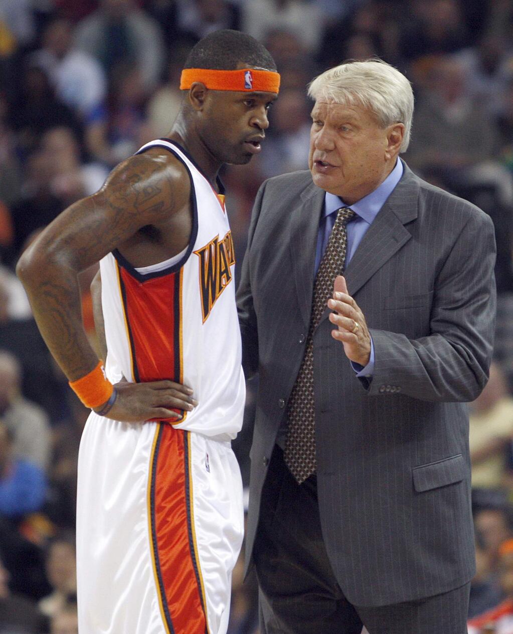 Then-Golden State Warriors coach Don Nelson, right, speaks with Stephen Jackson during the first half against the Houston Rockets Wednesday, Oct. 28, 2009, in Oakland. (AP Photo/Ben Margot)