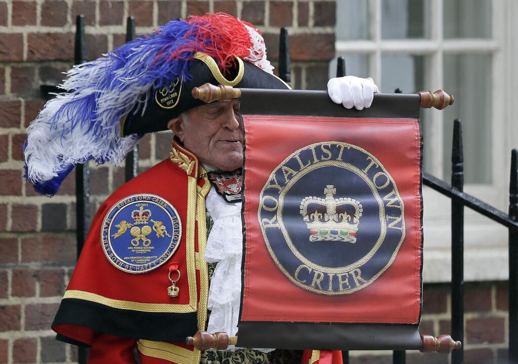 Town Crier Tony Appleton announces that the Duchess of Cambridge has given birth to a baby boy outside the Lindo wing at St Mary's Hospital in London London, Monday, April 23, 2018. Kensington Palace says the Duchess of Cambridge has given birth to her third child, a boy weighing 8 pounds, 7 ounces (3.8 kilograms). (AP Photo/Tim Ireland)
