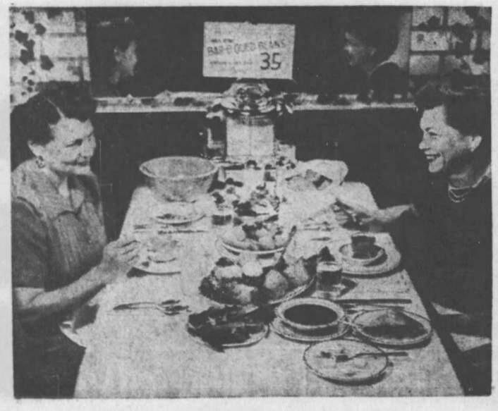Two diners enjoy a family-style meal, which cost $1.25 per plate, in 1956 at Don's Fine Foods in Petaluma. (ARGUS-COURIER ARCHIVE PHOTO)