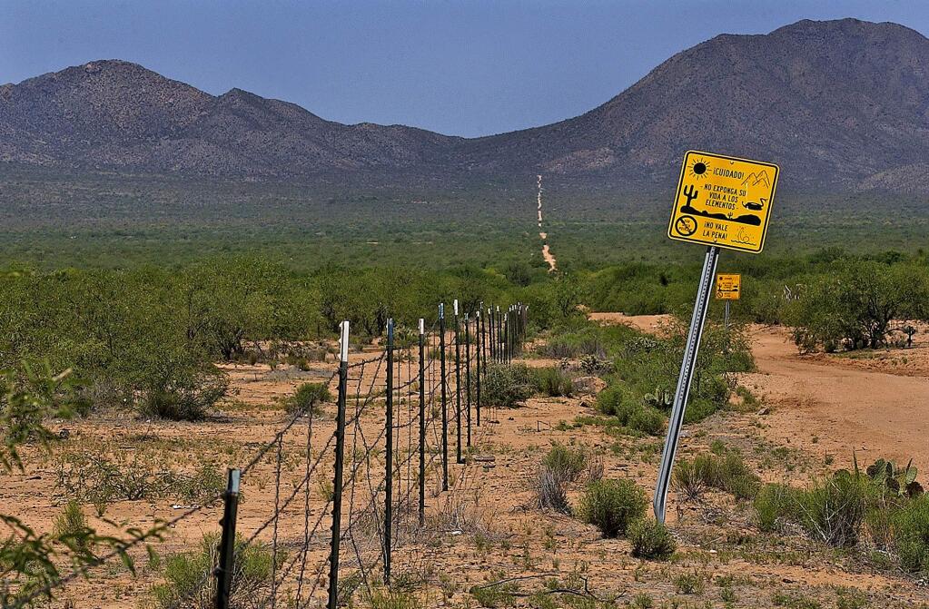 A warning sign along the international border in San Miguel, Arizona warns of the dangers of crossing the desert. (MATT YORK / Associated Press, 2004)