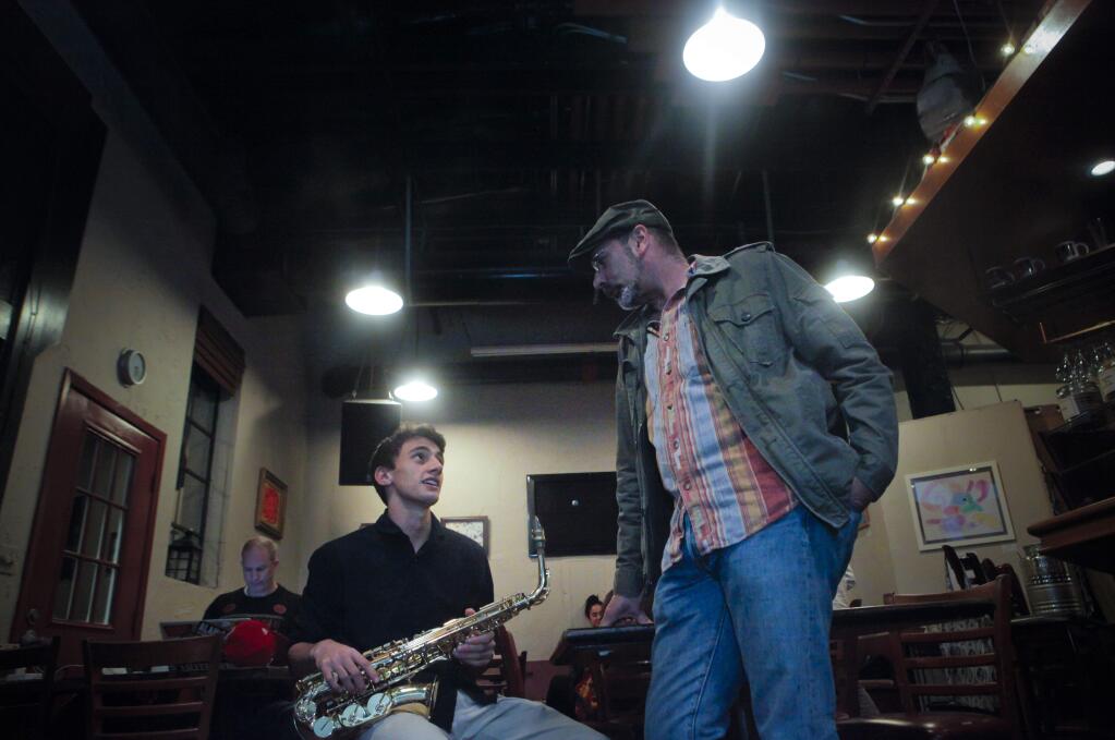 Dave Brouillette, president of the Petaluma High School Music Boosters, was inspired to create an open mic night for teenagers at Aqus Cafe. His son, Jesse, 17, who plays the sax, plans to participate. (CRISSY PASCUAL/ARGUS-COURIER STAFF)
