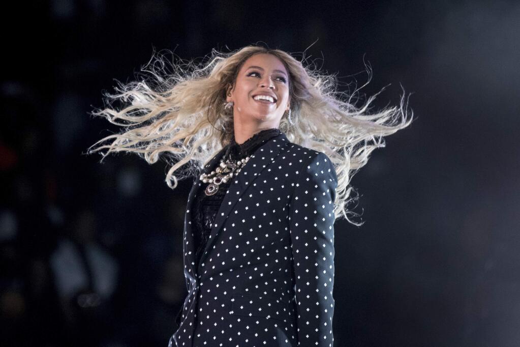 FILE - In this Nov. 4, 2016 file photo, Beyonce performs at a Get Out the Vote concert for Democratic presidential candidate Hillary Clinton in Cleveland. Beyonce, Blake Shelton, Barbra Streisand and Oprah Winfrey will headline a one-hour benefit telethon to benefit Hurricane Harvey victims that will be simulcast Sept. 12, 2017, on ABC, CBS, NBC, Fox and CMT. (AP Photo/Andrew Harnik, File)
