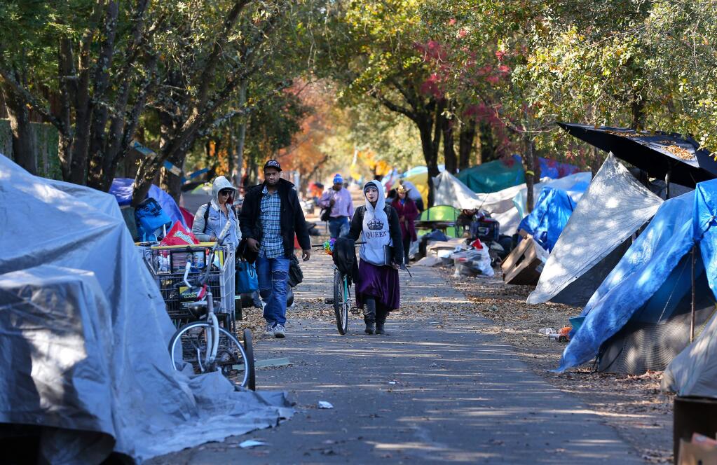 A homeless encampment lines both sides of the Joe Rodota Trail, west of Stony Point Road, in Santa Rosa on Tuesday, Nov. 19, 2019. (CHRISTOPHER CHUNG/ PD)