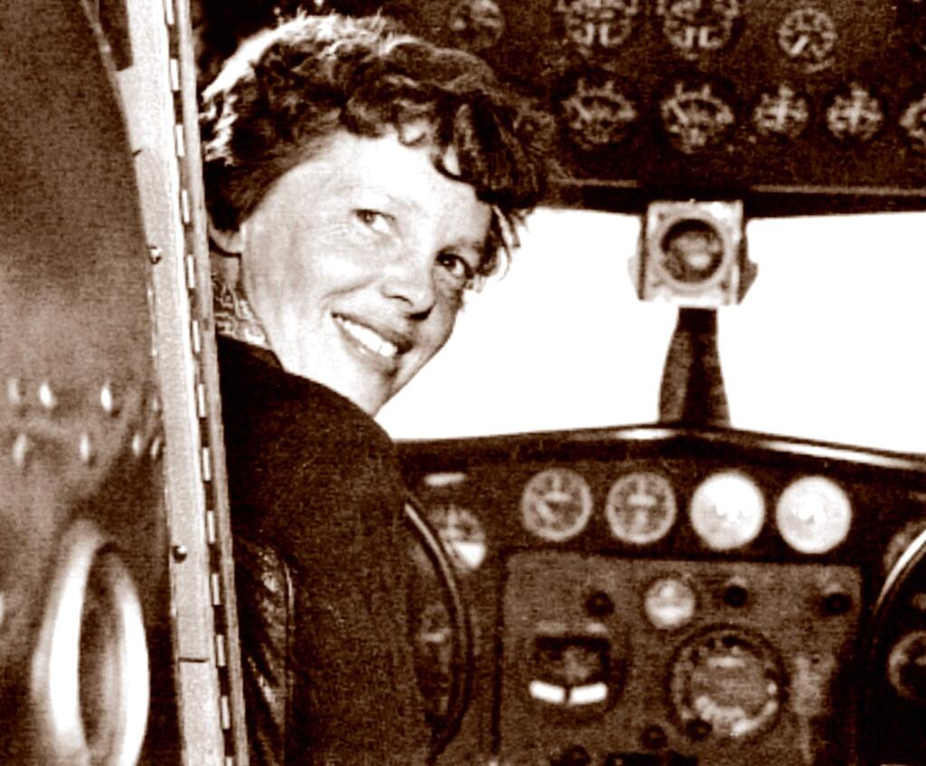 In this May 20, 1937 photo, provided by The Paragon Agency, shows aviator Amelia Earhart at her Electra plane cabin, taken by Albert Bresnik at Burbank Airport in Burbank, Calif. It was a clear spring day in 1937 when Amelia Earhart, ready to make history by flying around the world, brought her personal photographer to a small Southern California airport to document the journey's beginning. (Albert Bresnik/The Paragon Agency via AP)