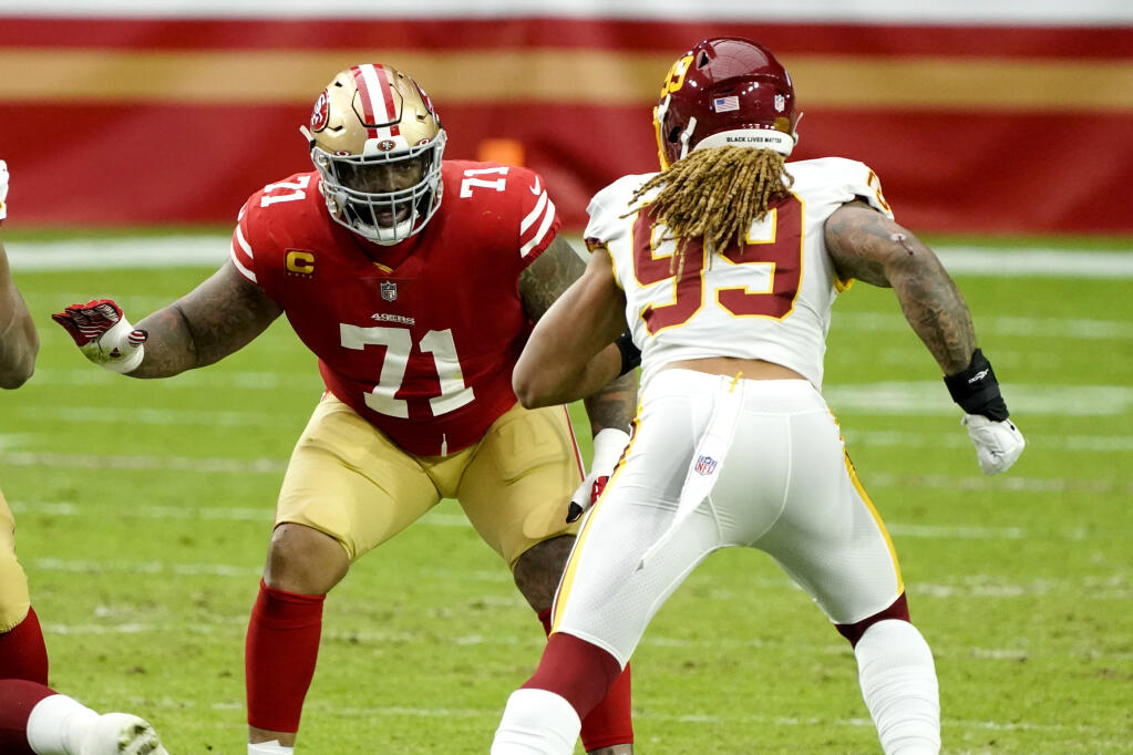 San Francisco 49ers offensive tackle Trent Williams (71) battles Washington Football Team defensive end Chase Young (99) during the first half of an NFL football game, Sunday, Dec. 13, 2020, in Glendale, Ariz. (AP Photo/Rick Scuteri)