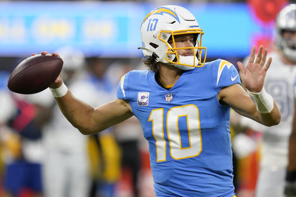 Los Angeles Chargers quarterback Justin Herbert throws a pass during the first half of an NFL football game against the Las Vegas Raiders Monday, Oct. 4, 2021, in Inglewood, Calif. (AP Photo/Ashley Landis)