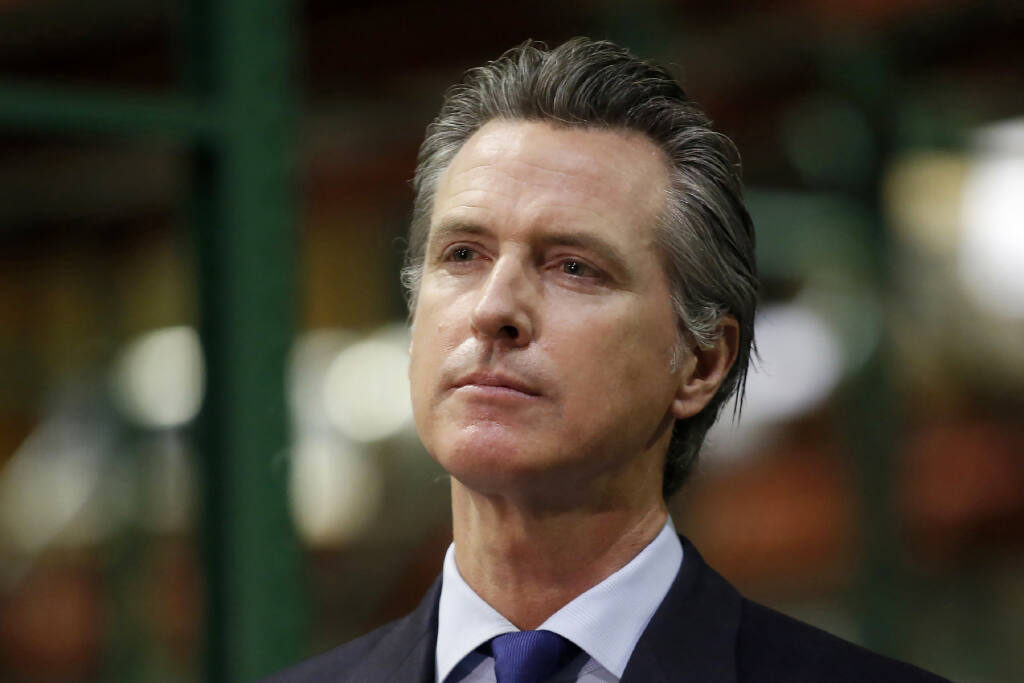 FILE - In this June 6, 2020, file photo, California Gov. Gavin Newsom listens to a reporter's question during a news conference in Rancho Cordova, Calif.  (AP Photo/Rich Pedroncelli, Pool, File)