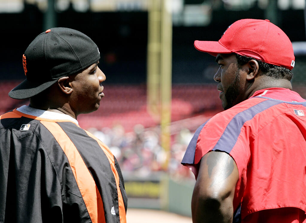 The San Francisco Giants’ Barry Bonds, left, chats with the Red Sox’s David Ortiz prior to their game at Fenway Park in Boston on Saturday, June 16, 2007. (Winslow Townson / ASSOCIATED PRESS)