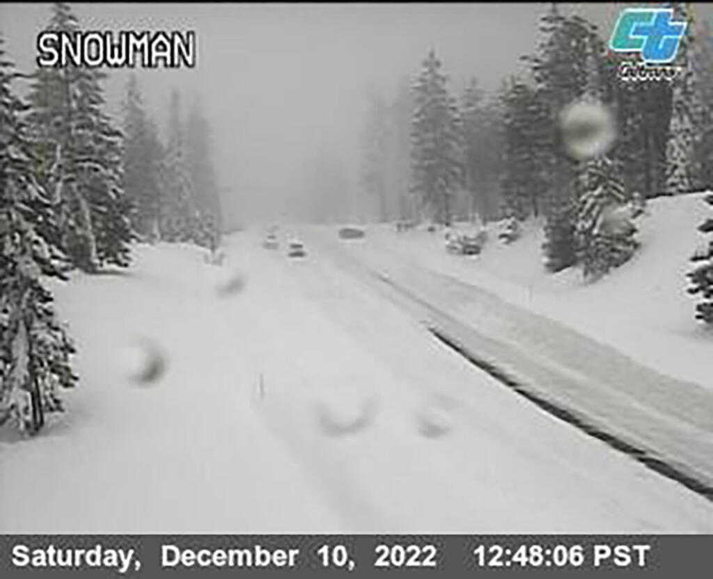 This image from a Caltrans traffic camera shows snow conditions on California SR-89 Snowman in Shasta-Trinity National Forest, Calif., Saturday, Dec. 10, 2022. A stretch of California Highway 89 was closed due to heavy snow between Tahoe City and South Lake Tahoe, Cali., the highway patrol said. Interstate 80 between Reno and Sacramento remained open but chains were required on tires for most vehicles. (Caltrans via AP)