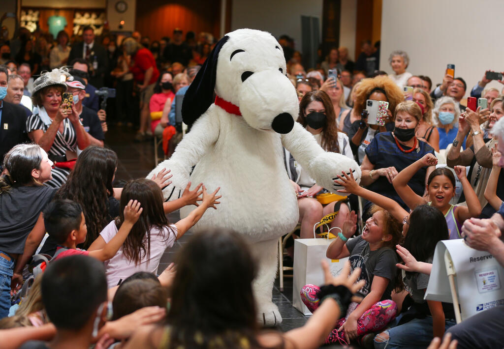 Snoopy receives a warm welcome from fans at a first-day-of-issue ceremony for new “forever” stamps commemorating the birth centennial of cartoonist Charles M. Schulz in Santa Rosa on Friday, Sept. 30, 2022. (Christopher Chung/The Press Democrat)