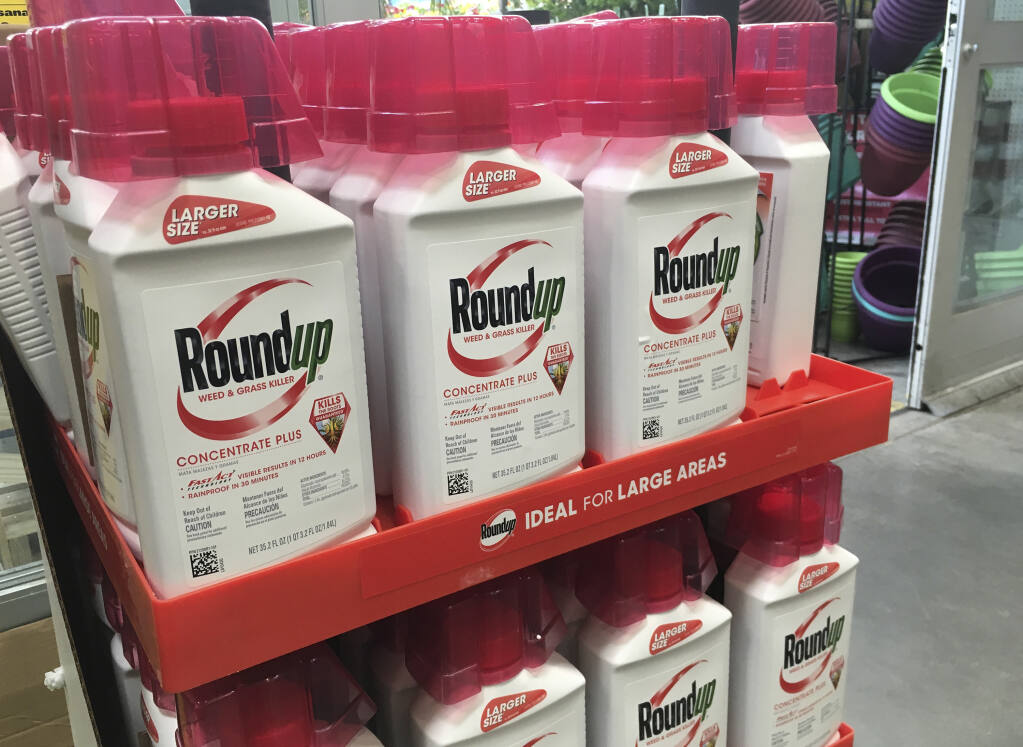 FILE - In this, Feb. 24, 2019, file photo, containers of Roundup are displayed at a store in San Francisco.   (AP Photo/Haven Daley, File)