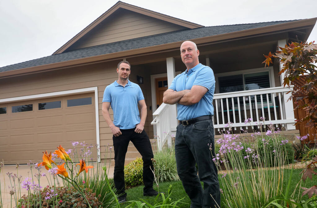 Bill Wallace, left, and Matt Everson, of BW Builder, Inc., are licensed contractors who create estimates so that fire victims can take the estimates to negotiate a better settlement with their insurance company.(Christopher Chung / The Press Democrat)