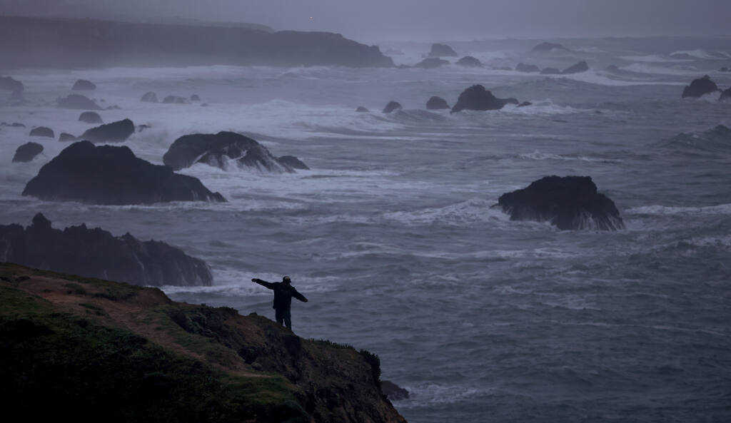 At the north end of Gleason Beach, Tuesday, Jan. 4, 2021, Santa Rosa resident Javier Alvarez uses a handline to fish the roiling Pacific Ocean north of Bodega Bay. (Kent Porter / The Press Democrat) 2021