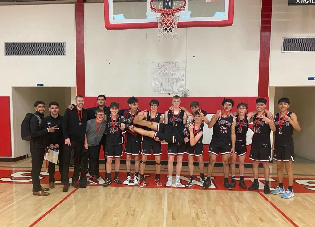 The Healdsburg boys basketball team poses after winning the Sutter Home Invitational tournament at St. Helena High School for the second straight year on Saturday, Dec. 3, 2022. (Courtesy of Tasha Vanden Heuvel)