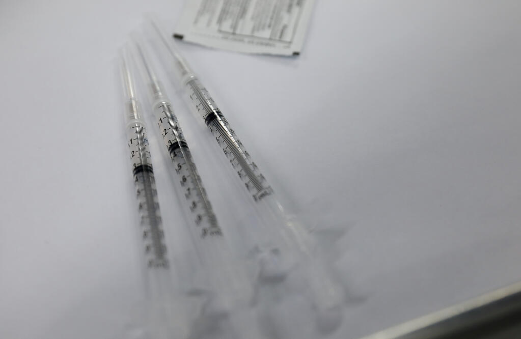 The last three doses of the day of Pfizer COVID-19 vaccine at the Sonoma County Medical Association vaccination clinic, at the Sonoma County Fairgrounds, in Santa Rosa on Friday, April 23, 2021. (Christopher Chung / The Press Democrat)