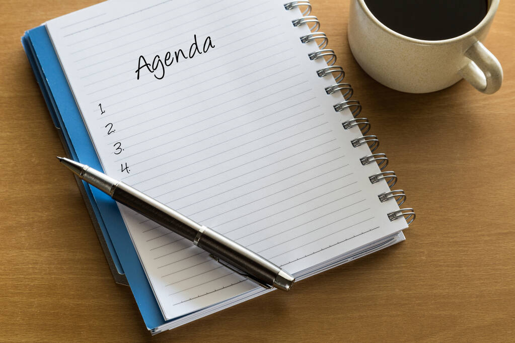Agenda written on notebook with blank list, planning conceptual
