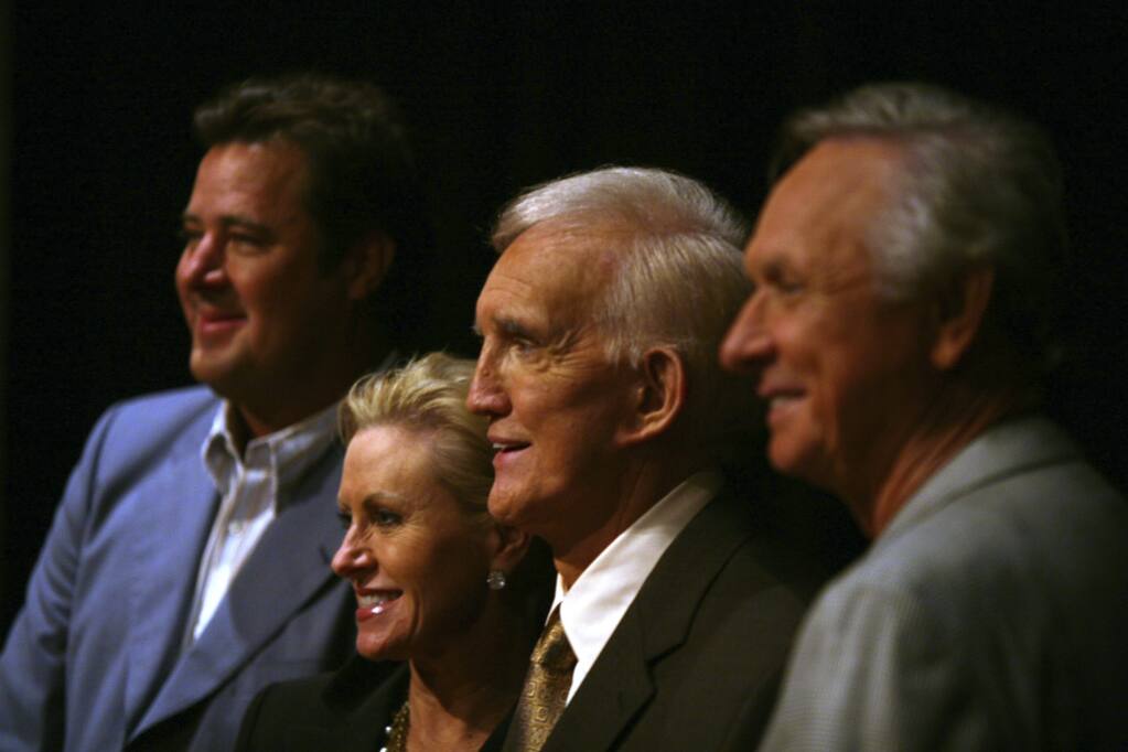FILE - Tammy Genovese, second left, Country Music Association Chief Operating Officer, poses for a photo with Vince Gill, left, Ralph Emery and Mel Tillis, right, Tuesday, Aug. 7, 2007, in Nashville, Tenn., after it was announced that the three men will be inducted into the Country Music Hall of Fame. Emery, who became known as the dean of country music broadcasters over more than a half-century in both radio and television, died Saturday, Jan. 15, 2022, his family said. He was 88. (AP Photo/Jeff Adkins, File)