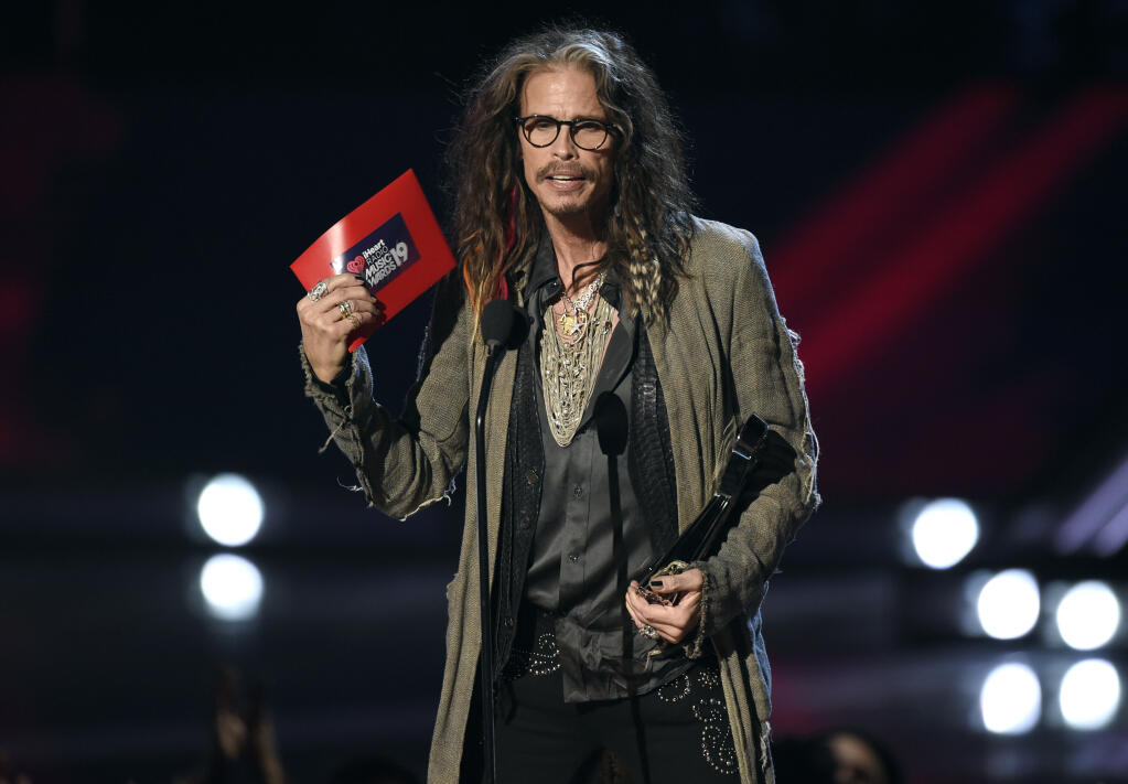 FILE - Steven Tyler presents the award for song of the year at the iHeartRadio Music Awards on Thursday, March 14, 2019, at the Microsoft Theater in Los Angeles. A woman who has previously said Tyler had an illicit sexual relationship with her when she was a teenager is now suing the Aerosmith frontman for sexual assault, sexual battery and intentional infliction of emotional distress. The lawsuit was filed Tuesday, Dec. 27, 2022 under a 2019 California law that gave adult victims of childhood sexual assault a three-year window to file past claims. Sunday is the deadline to file any lawsuits. (Photo by Chris Pizzello/Invision/AP, File)