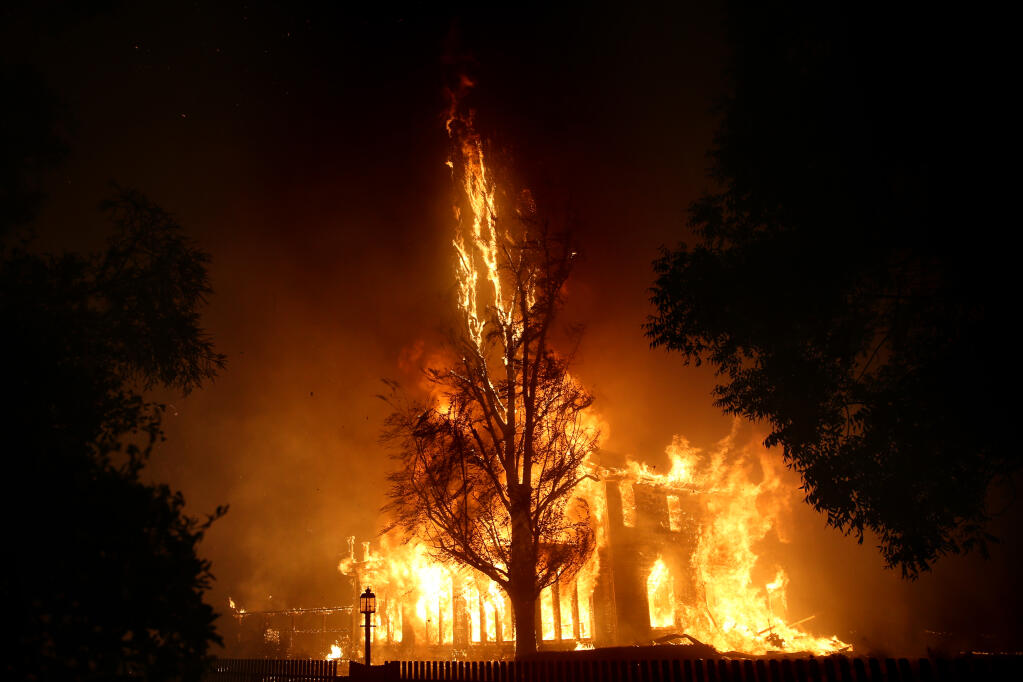 A home burns on Kertsinger Road during the Shady Fire in Santa Rosa, Monday, Sept. 28, 2020. (Beth Schlanker / The Press Democrat file)