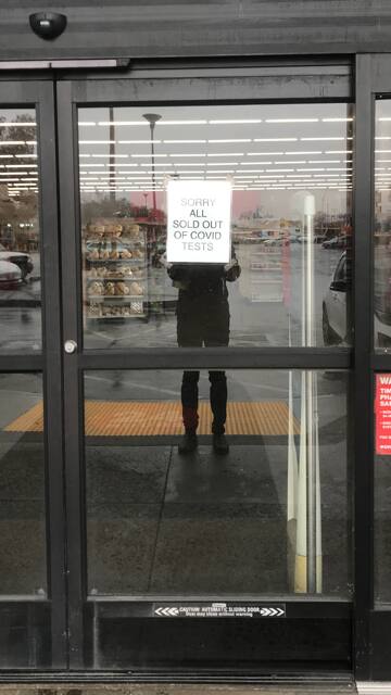 A sign on the door of the CVS on East Washington Avenue in Petaluma advises shoppers that it has run out COVID at-home rapid self-tests. (Austin Murphy)