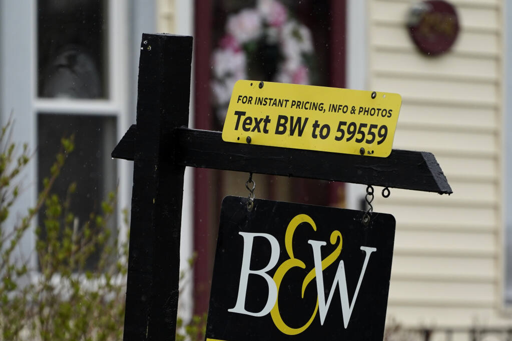 A for-sale sign is displayed outside a home in Wheeling, Ill., May 5, 2022. (AP Photo/Nam Y. Huh)