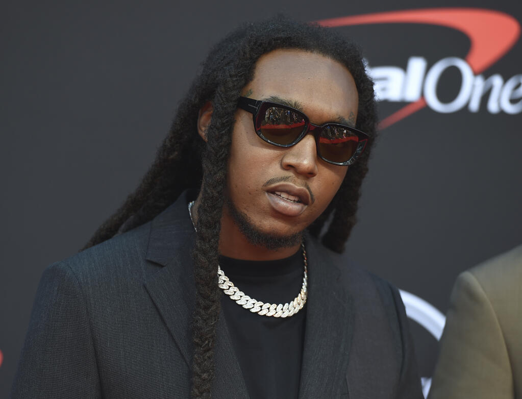 FILE - Takeoff arrives at the ESPY Awards in Los Angeles on July 10, 2019. Authorities said Wednesday, Nov. 30, 2022, that a man who has been accused of illegally having a gun at the time that rapper Takeoff was fatally shot last month outside a private party at a downtown Houston bowling alley has been charged in connection with the case. (Photo by Jordan Strauss/Invision/AP, File)