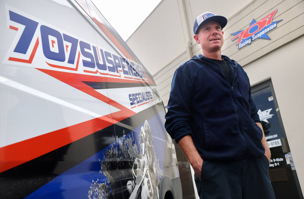 Joel Burkett, owner of 707 Racing Suspension in Rohnert Park, feels the name of his business is established enough that changes to the area code number shouldn't be a problem.  (Christopher Chung/ The Press Democrat)