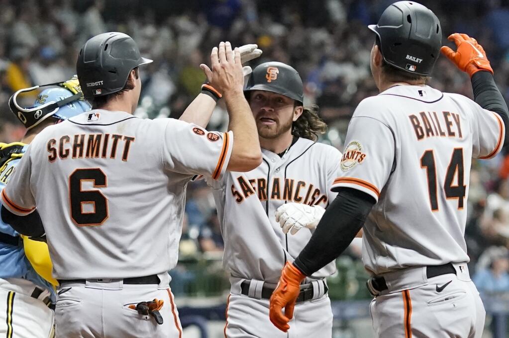 The Giants’ Brett Wisely is congratulated by Casey Schmitt and Patrick Bailey after hitting a three-run home run during the third inning against the Brewers on Friday, May 26, 2023, in Milwaukee. (Morry Gash / ASSOCIATED PRESS)