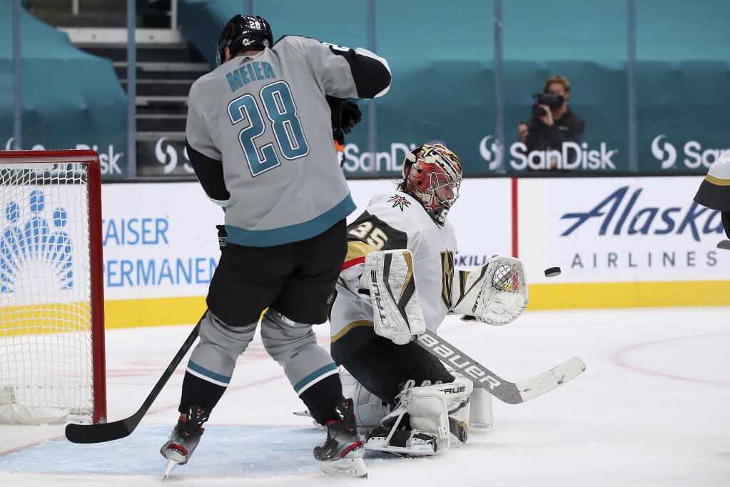 Vegas Golden Knights goaltender Oscar Dansk makes a save against San Jose Sharks right wing Timo Meier, left, during the second period in San Jose on Friday, March 5, 2021. (Josie Lepe / ASSOCIATED PRESS)