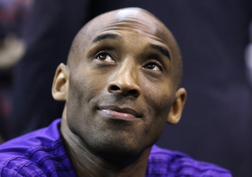 FILE - In this March 28, 2016 file photo, Los Angeles Lakers forward Kobe Bryant looks on before the start of their NBA basketball game against the Utah Jazz in Salt Lake City. (AP Photo/Rick Bowmer, File)