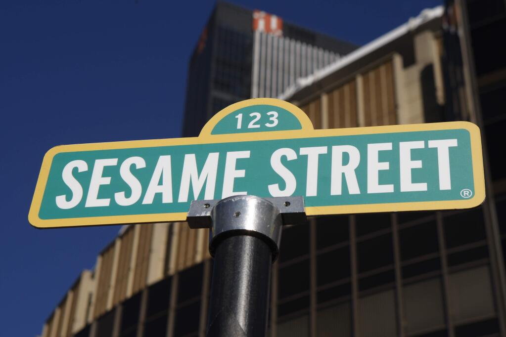 FILE - A sign for Sesame Street is shown in front of Madison Square Garden. (AP Photo/Kathy Willens)