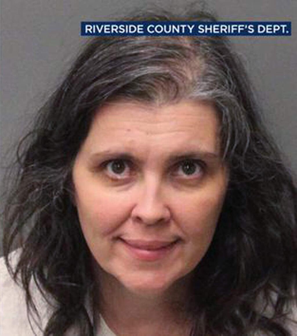 In this Sunday, Jan. 14, 2018 photo released by the Riverside County Sheriff's Department shows Louise Anna Turpin. Authorities say an emaciated teenager led deputies to a California home where her 12 brothers and sisters were locked up in filthy conditions, with some of them malnourished and chained to beds. Riverside County sheriff's deputies arrested the parents David Allen Turpin and Louise Anna Turpin on Sunday. The parents could face charges including torture and child endangerment. (Riverside County Sheriff's Department via AP)