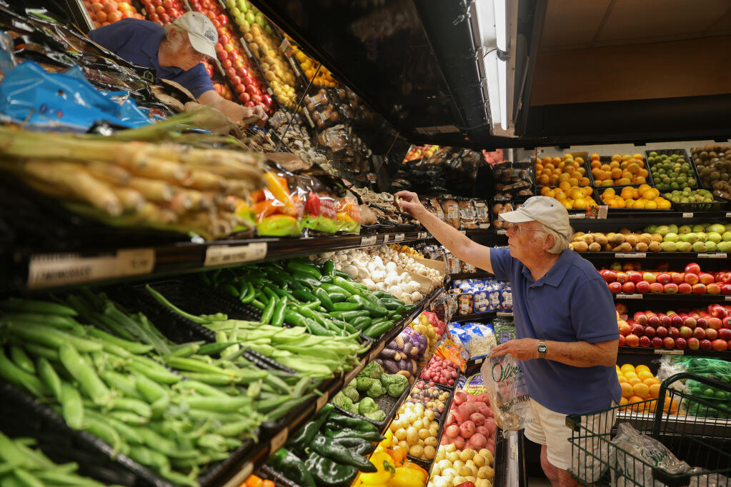 Roger Ellman, who has been vaccinated, enjoys being able to shop mask-free at Oliver's Market, at the Montecito Shopping Center, in Santa Rosa on Tuesday, June 15, 2021.  (Christopher Chung/ The Press Democrat)