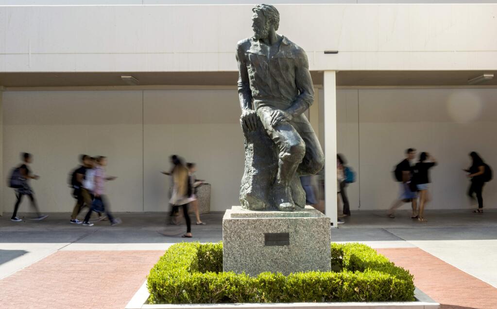 This Sept. 20, 2017 photo shows 'Prospector Pete' statue at California State University, Long Beach, Calif. The school will be ousting its 'Prospector Pete' statue because of the impact the 1849 gold rush had on indigenous people. A statement on the university website says the gold rush was 'a time in history when the indigenous peoples of California endured subjugation, violence and threats of genocide.' (Thomas R. Cordova/The Orange County Register via AP)