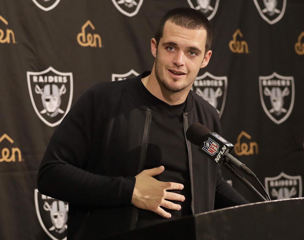 In this Nov. 27, 2016, file photo, Oakland Raiders quarterback Derek Carr speaks at a news conference after a game against the Carolina Panthers, in Oakland. (AP Photo/Marcio Jose Sanchez, File)