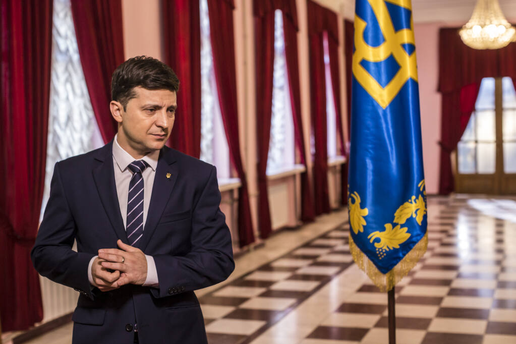 Months before he would be elected to the office for real, Volodymyr Zelenskiy plays the president of Ukraine on set of the comedy "Servant of the People," in Kiev, Feb. 17, 2019. Zelenskiy has placed allies from his comedy career in key positions throughout the government, including top advisers, legislators, administrators and even an intelligence chief. (Brendan Hoffman/The New York Times)