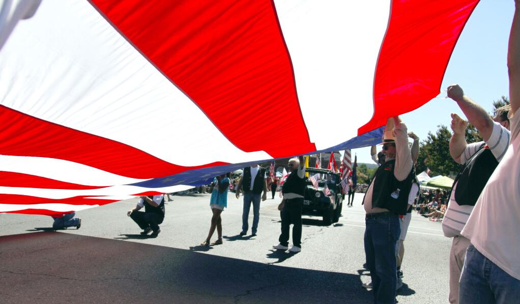 Bill Hoban/Index-TribuneThe Native Sons of the Golden West Sonoma Parlor 111 marched with their giant American flag.