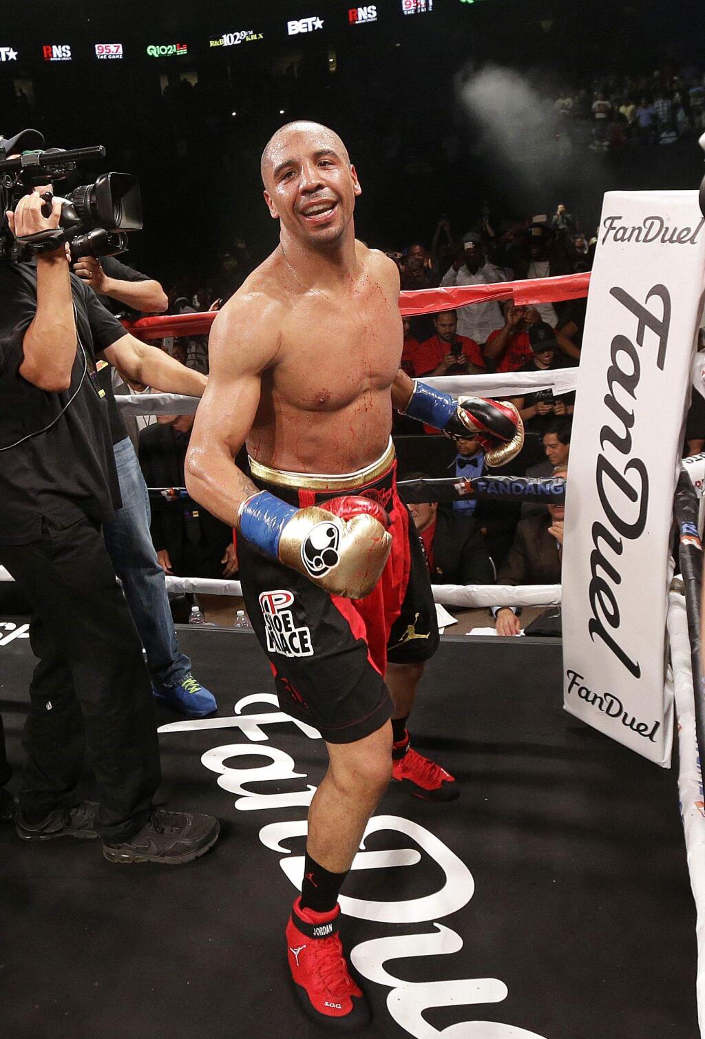 Andre Ward celebrates after beating Paul Smith in a cruiserweight boxing match in Oakland, Calif., Saturday, June 20, 2015. Ward won when Smith's corner threw in the towel in the ninth round. (AP Photo/Jeff Chiu)