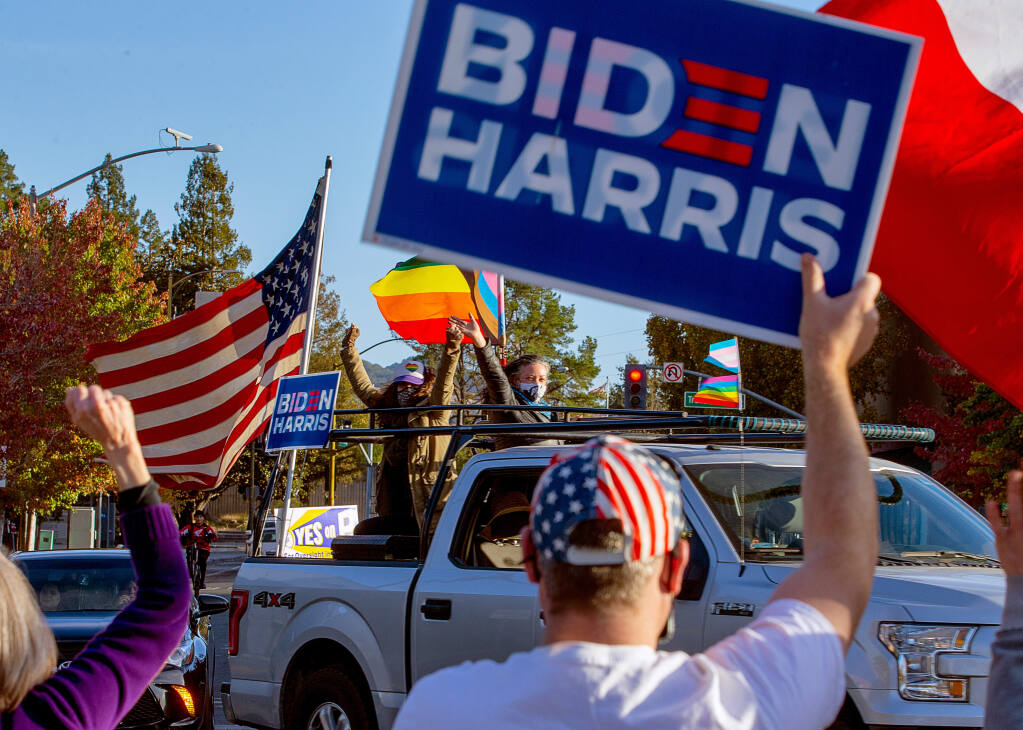Supporters of President-elect Joe Biden and Vice President-elect Kamala Harris celebrate the Democrats' victory at Old Courthouse Square in Santa Rosa on Saturday, Nov. 7, 2020. (Alvin A.H. Jornada / The Press Democrat)