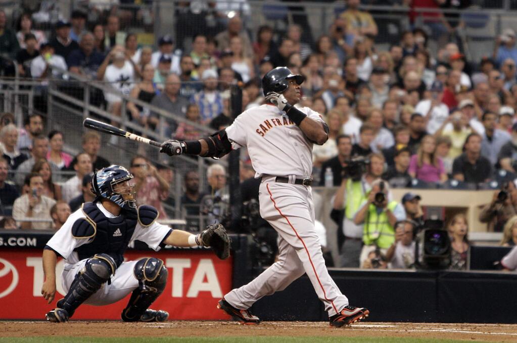 Barry Bonds hits home run No. 755 to tie Hank Aaron for the Major League record against the San Diego Padres on Saturday, Aug. 4, 2007. (John Burgess / The Press Democrat)