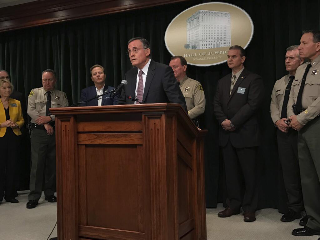 Fred Leeds, the stepson of victim Susan Leeds, speaks during a news conference with Los Angeles County Sheriff Jim McDonnell and other officials in Los Angeles on Friday, May 18, 2018. Sheriff's officials have made an arrest after Susan Leeds was fatally stabbed inside her car in the parking lot of a Southern California shopping mall. McDonnell said Friday that Cherie Townsend was arrested on suspicion of murder in connection with the May 3 stabbing. (AP Photo/Mike Balsamo)